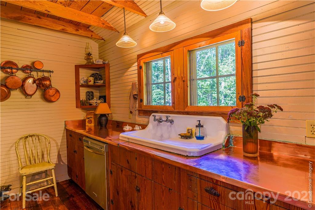 150 Staton Ridge Road Saluda, NC 28773 - Photo 5 of 44 a bathroom with a sink and a large mirror