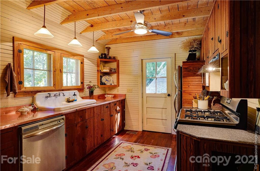150 Staton Ridge Road Saluda, NC 28773 - Photo 6 of 44 a kitchen with a stove and a sink