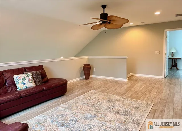 a living room with furniture and a rug