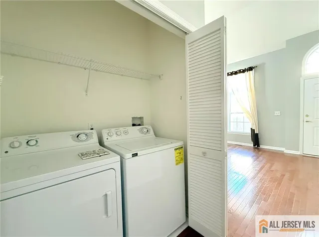 a view of storage and utility room with washer and dryer