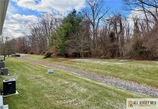 a view of a field with of trees