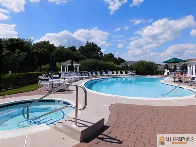 a view of a swimming pool with a patio
