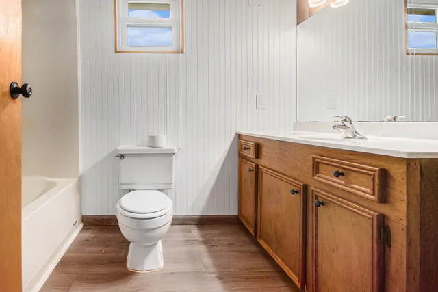 a bathroom with a sink toilet and vanity