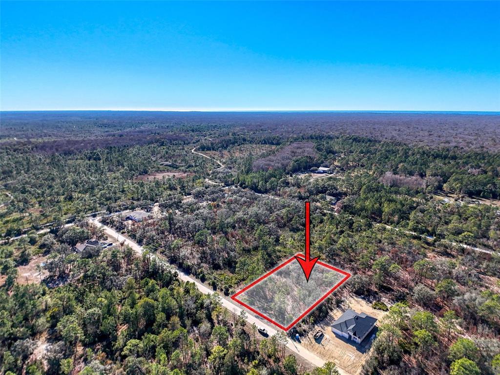 18079 Ramsey Road Weeki Wachee, FL 34614 - Photo 31 of 37 an aerial view of a city with lots of residential buildings