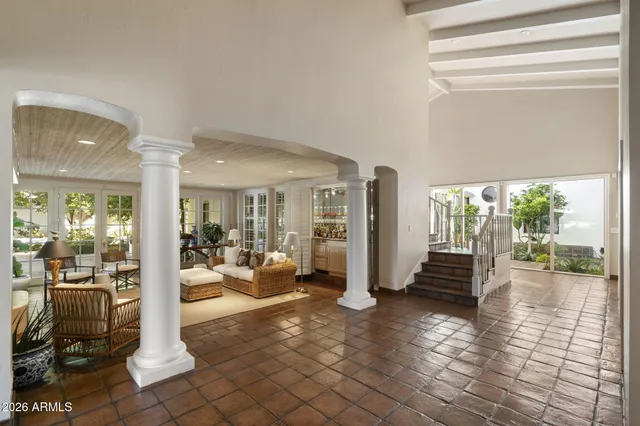 a view of a dining room with furniture and chandelier