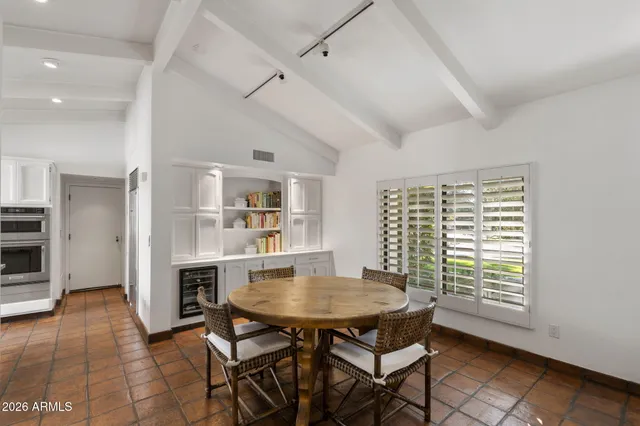 a bathroom with a sink and vanity