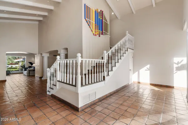 a bedroom with a bed and a night stand