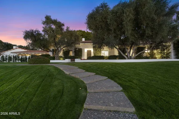 a front view of a house with a yard