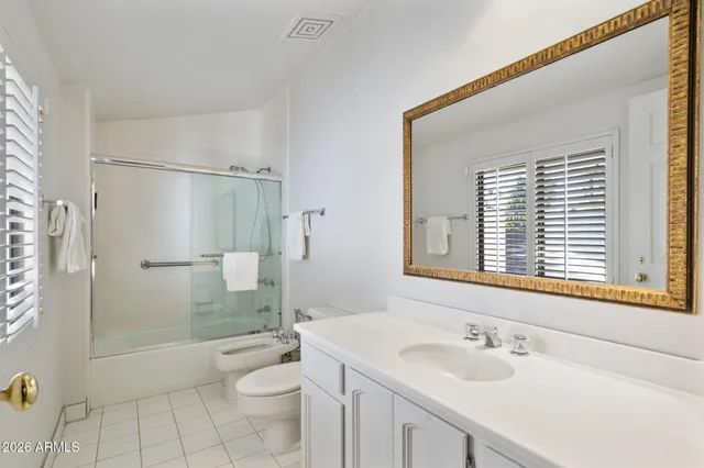 a bathroom with a double vanity sink mirror and double
