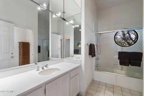 a view of a swimming pool with lounge chair