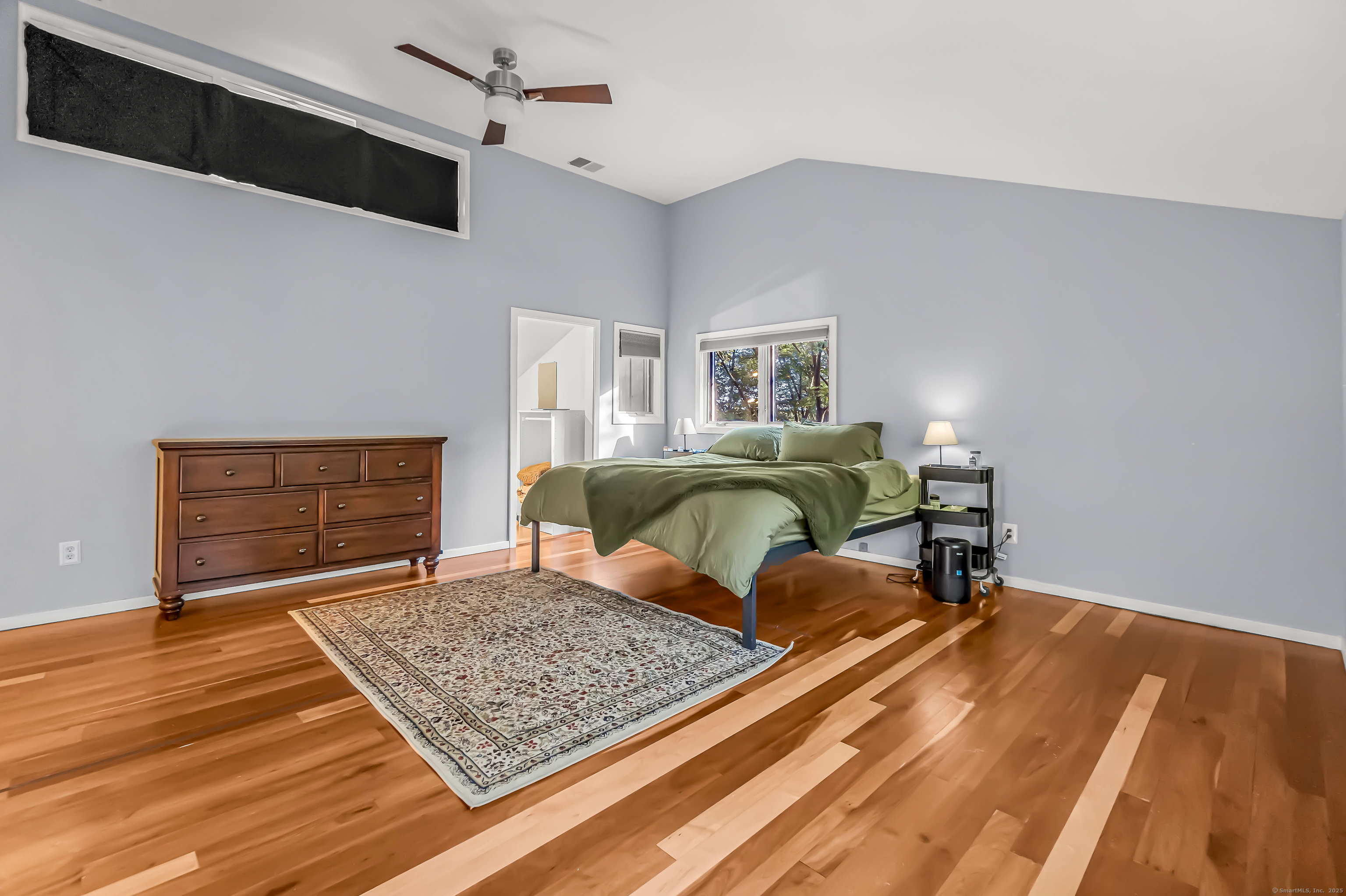 4 Old Gate Lane Newtown, CT 06470 - Photo 20 of 37 a bedroom with a bed and wooden floor