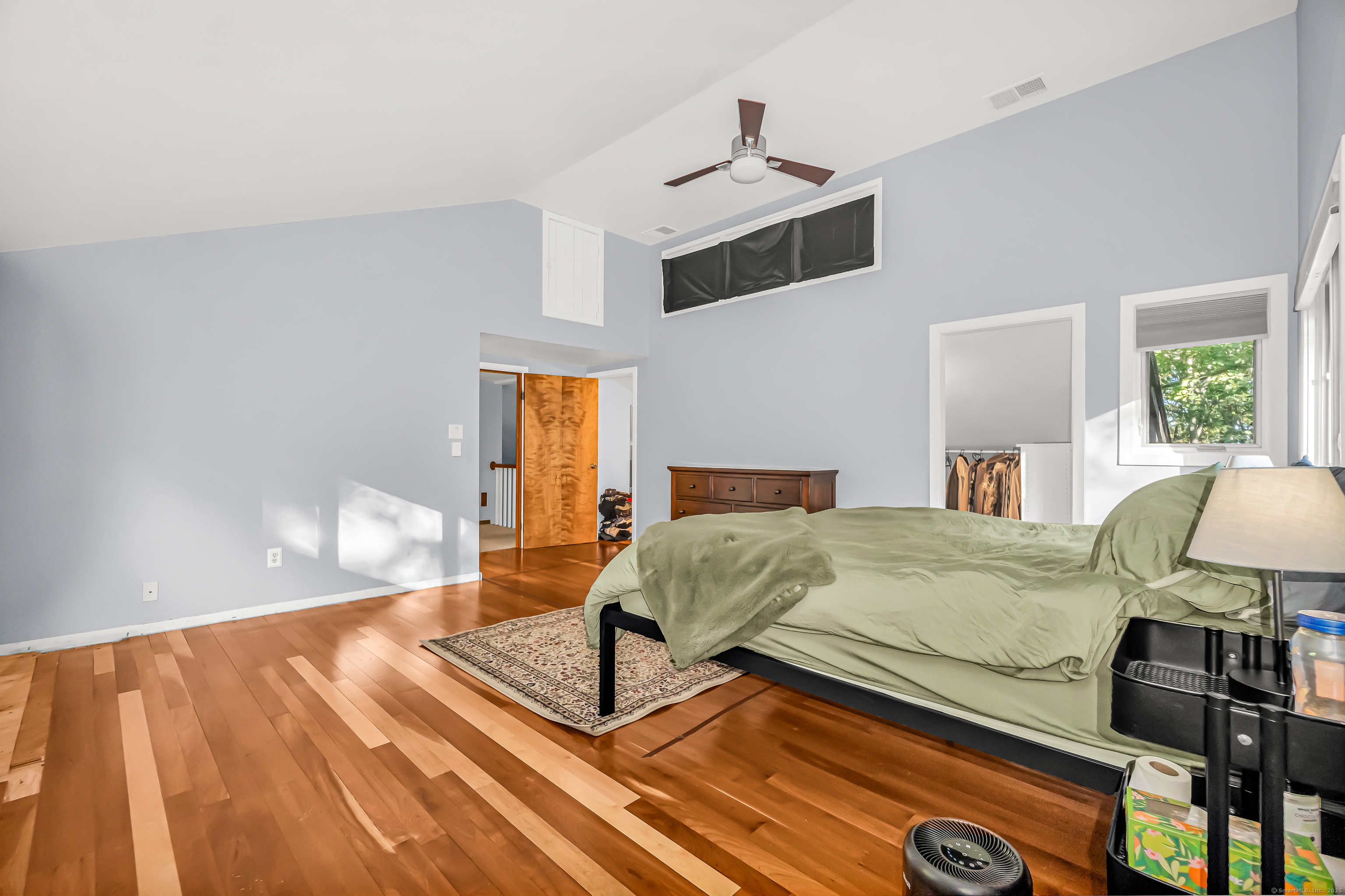 4 Old Gate Lane Newtown, CT 06470 - Photo 21 of 37 a bedroom with a bed and wooden floor