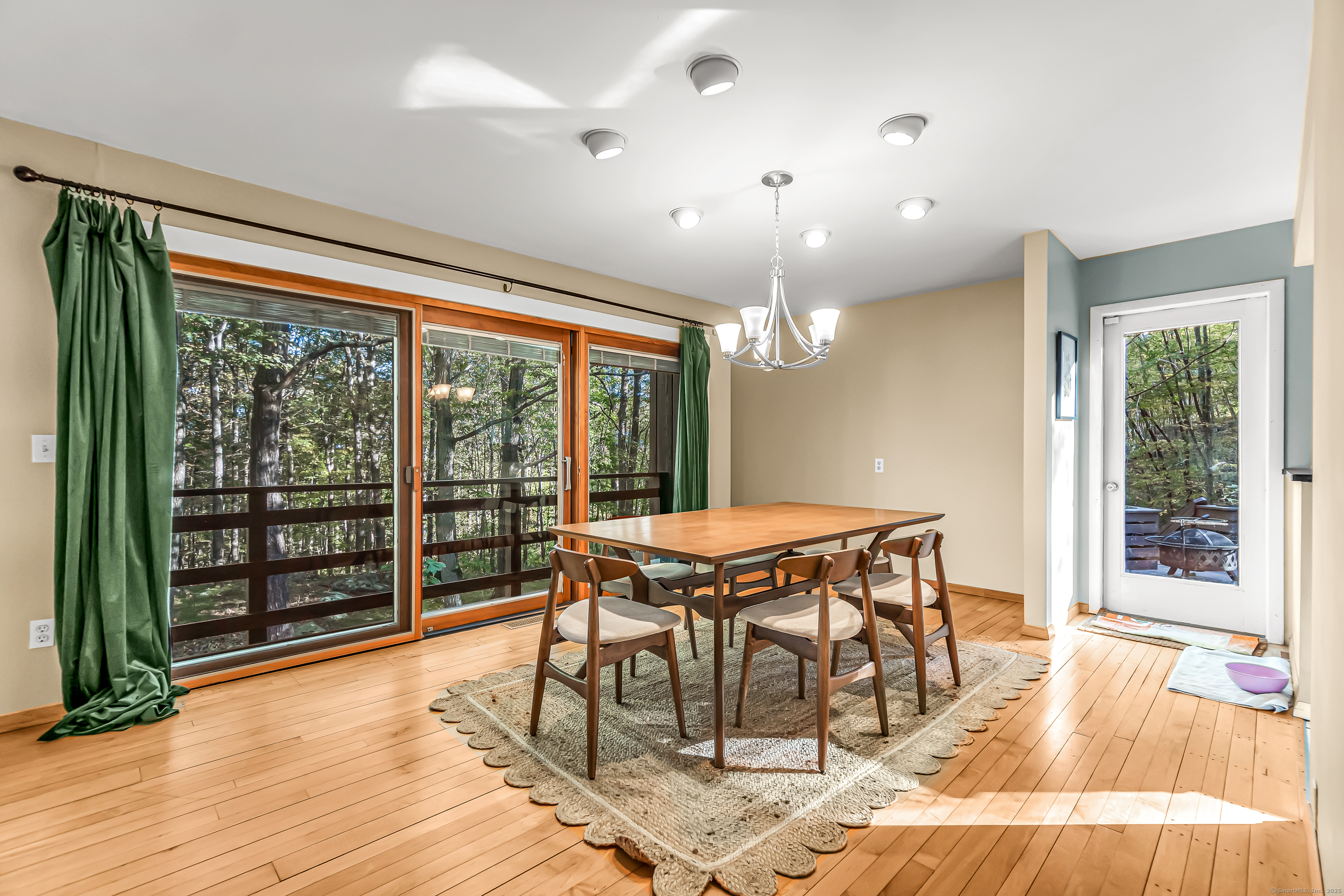 4 Old Gate Lane Newtown, CT 06470 - Photo 9 of 37 a dining room with furniture large windows and wooden floor