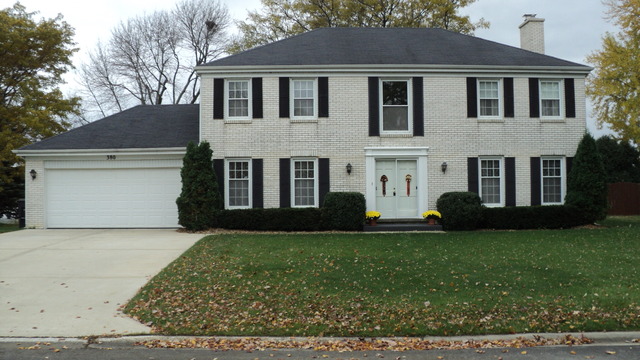 380 Northgate Road Lindenhurst, IL 60046 - Photo 1 of 19 a front view of a house with a garden