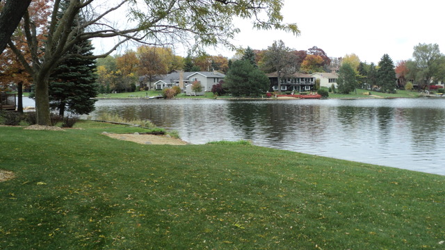 380 Northgate Road Lindenhurst, IL 60046 - Photo 19 of 19 a view of a lake with houses in the back