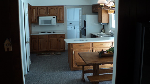380 Northgate Road Lindenhurst, IL 60046 - Photo 5 of 19 a kitchen with stainless steel appliances a stove and a refrigerator