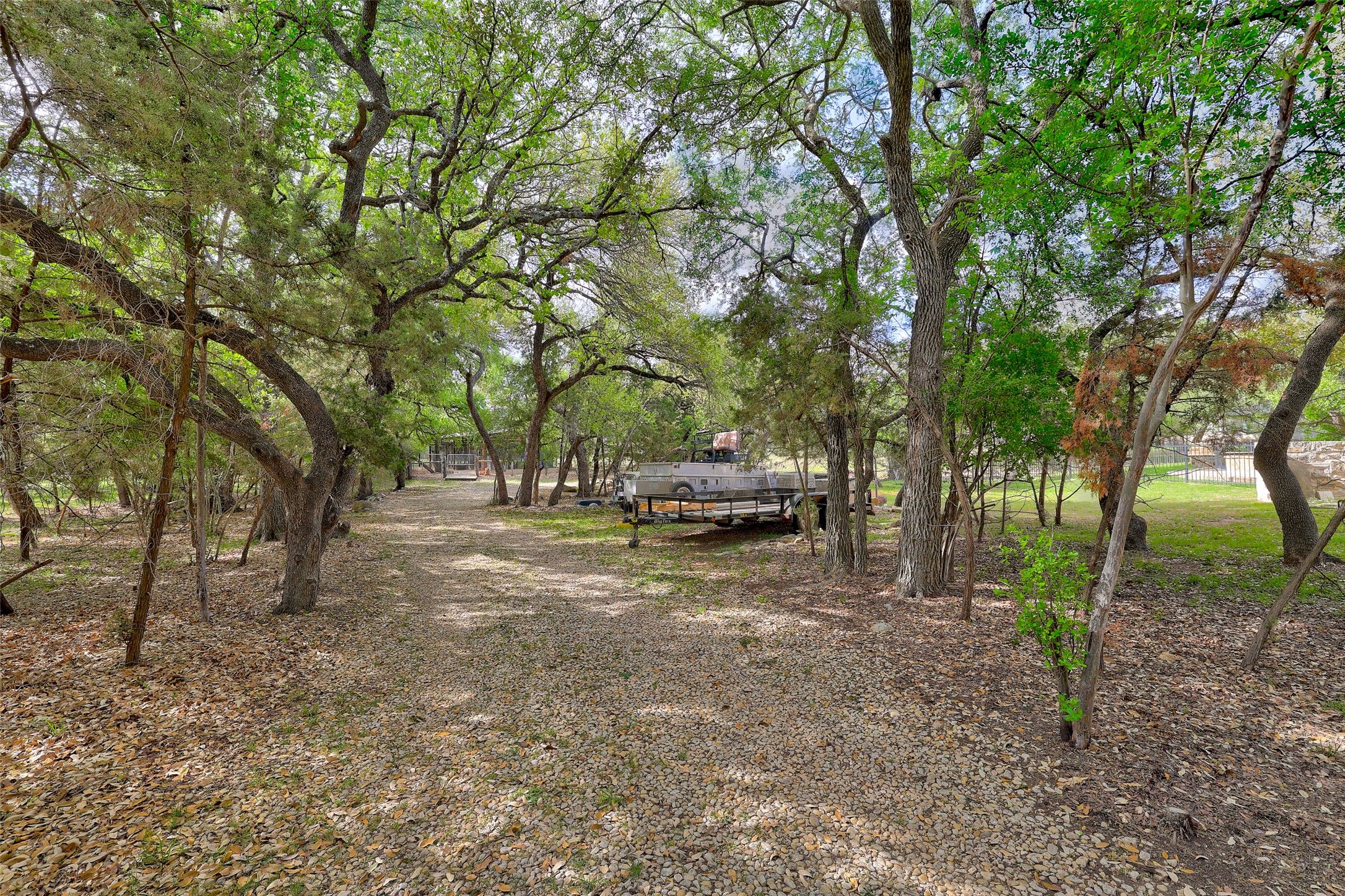426 Logan Ranch Road Georgetown, TX 78628 - Photo 33 of 40 Showing some of the side property leading to a fancy dog run