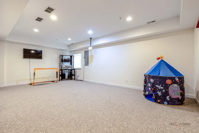 a room with furniture and a flat screen tv