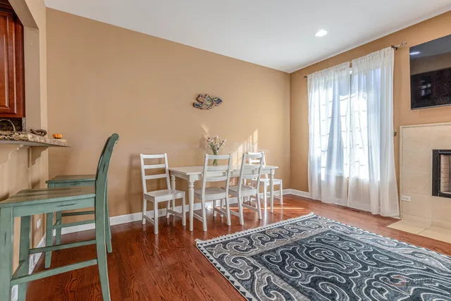 a view of a livingroom with furniture wooden floor and front door