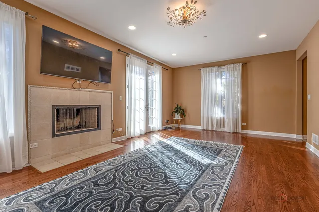 a spacious bedroom with a bed and a fireplace