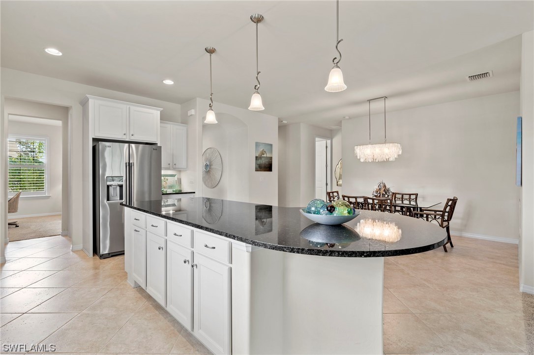 10844 Dennington Road Fort Myers, FL 33913 - Photo 1 of 50 a kitchen with stainless steel appliances granite countertop a sink a refrigerator and a wooden floor