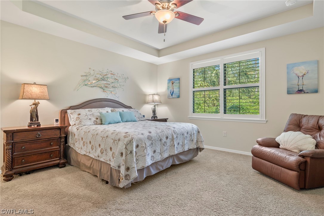 10844 Dennington Road Fort Myers, FL 33913 - Photo 12 of 50 a spacious bedroom with a bed and a couch