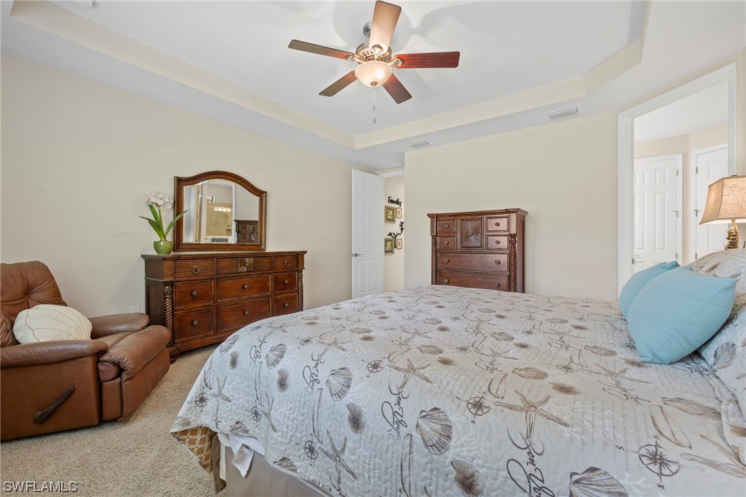 10844 Dennington Road Fort Myers, FL 33913 - Photo 13 of 50 a bedroom with a bed and a dresser