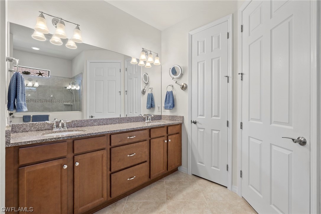10844 Dennington Road Fort Myers, FL 33913 - Photo 15 of 50 a bathroom with double vanity sinks and a shower