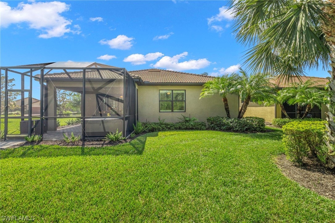 10844 Dennington Road Fort Myers, FL 33913 - Photo 24 of 50 a view of a backyard with a garden and plants