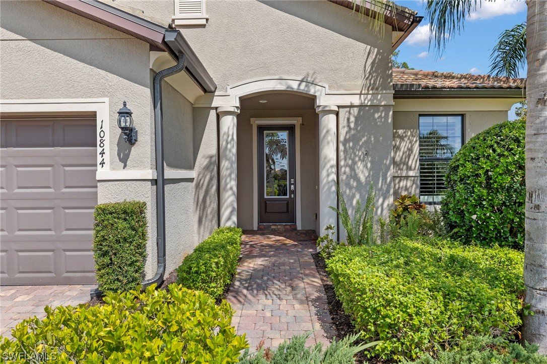 10844 Dennington Road Fort Myers, FL 33913 - Photo 27 of 50 a front view of a house with garden