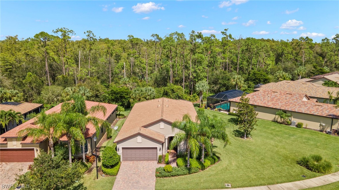 10844 Dennington Road Fort Myers, FL 33913 - Photo 30 of 50 a view of a swimming pool with a garden