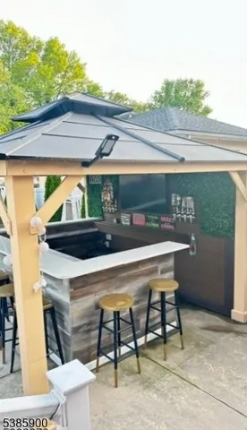 a patio with table and chairs