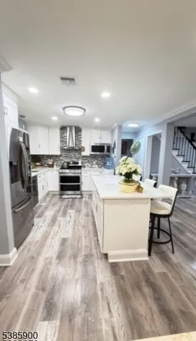 a view of kitchen with sink microwave and stove