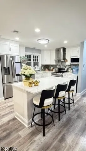 a kitchen with kitchen island granite countertop wooden cabinets and counter space