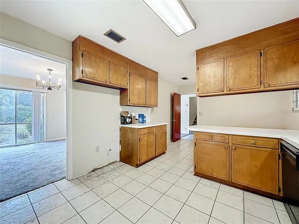 a view of a house with a door and wooden floor