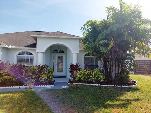 a view of a house with a garden