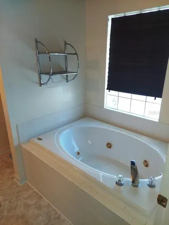 a white toilet sitting next to a white sink