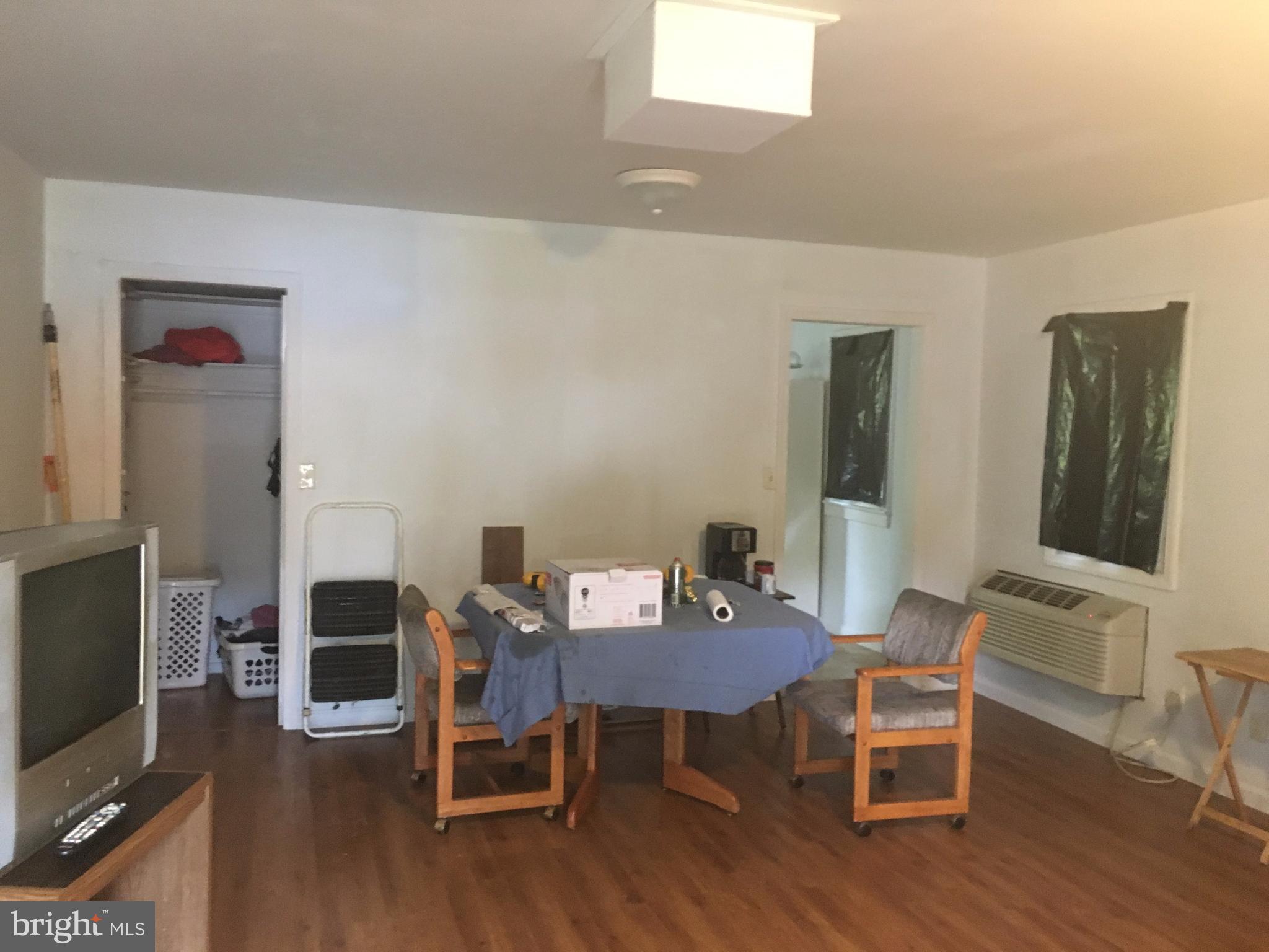 7904 Malcolm Road Clinton, MD 20735 - Photo 15 of 17 a view of a dining room with furniture and wooden floor