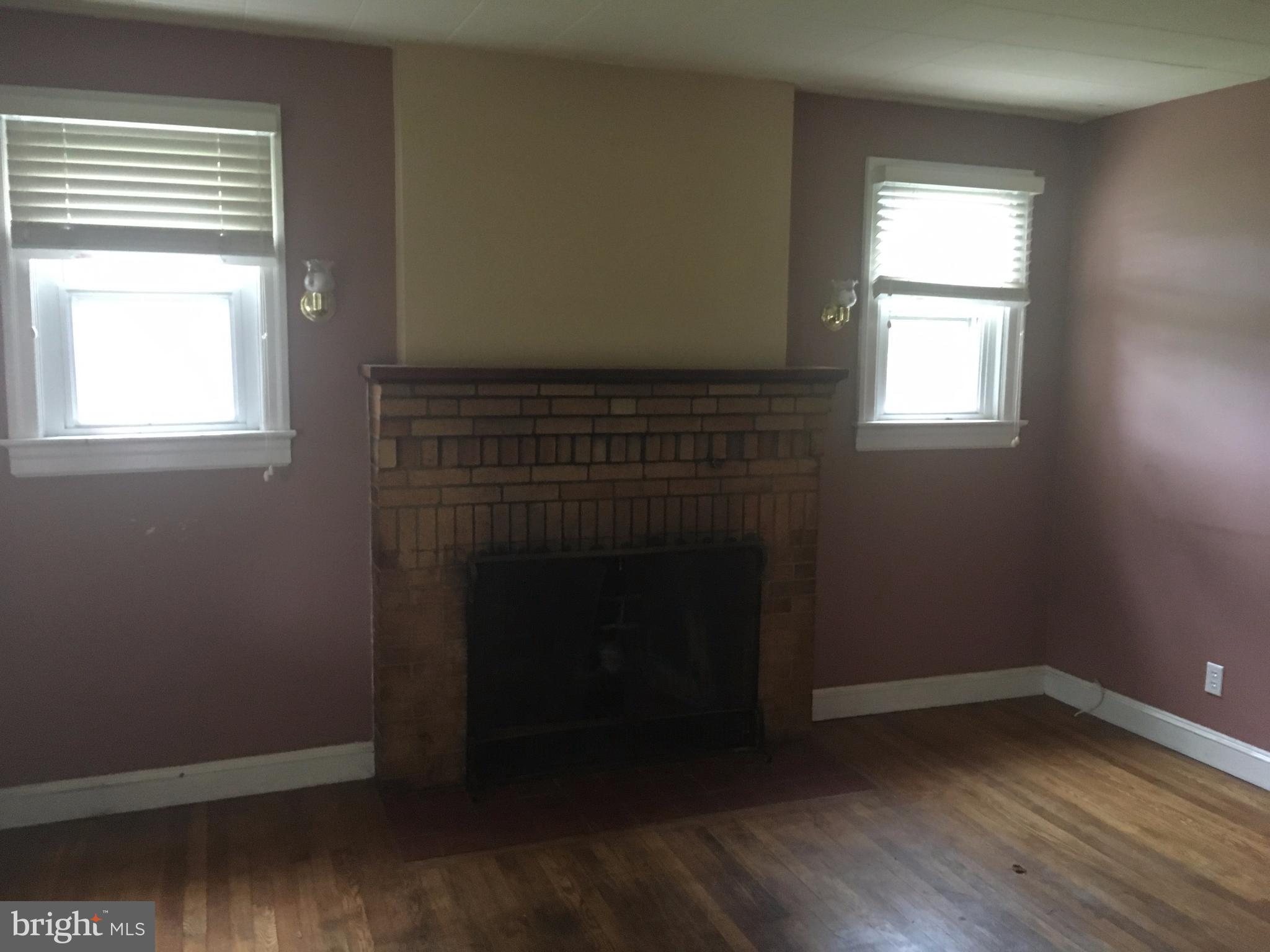 7904 Malcolm Road Clinton, MD 20735 - Photo 3 of 17 an empty room with wooden floor and windows