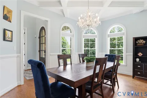 a kitchen with stainless steel appliances granite countertop a sink refrigerator stove and microwave