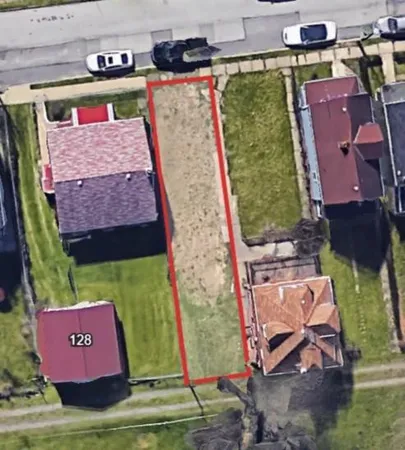 an aerial view of residential house with outdoor space