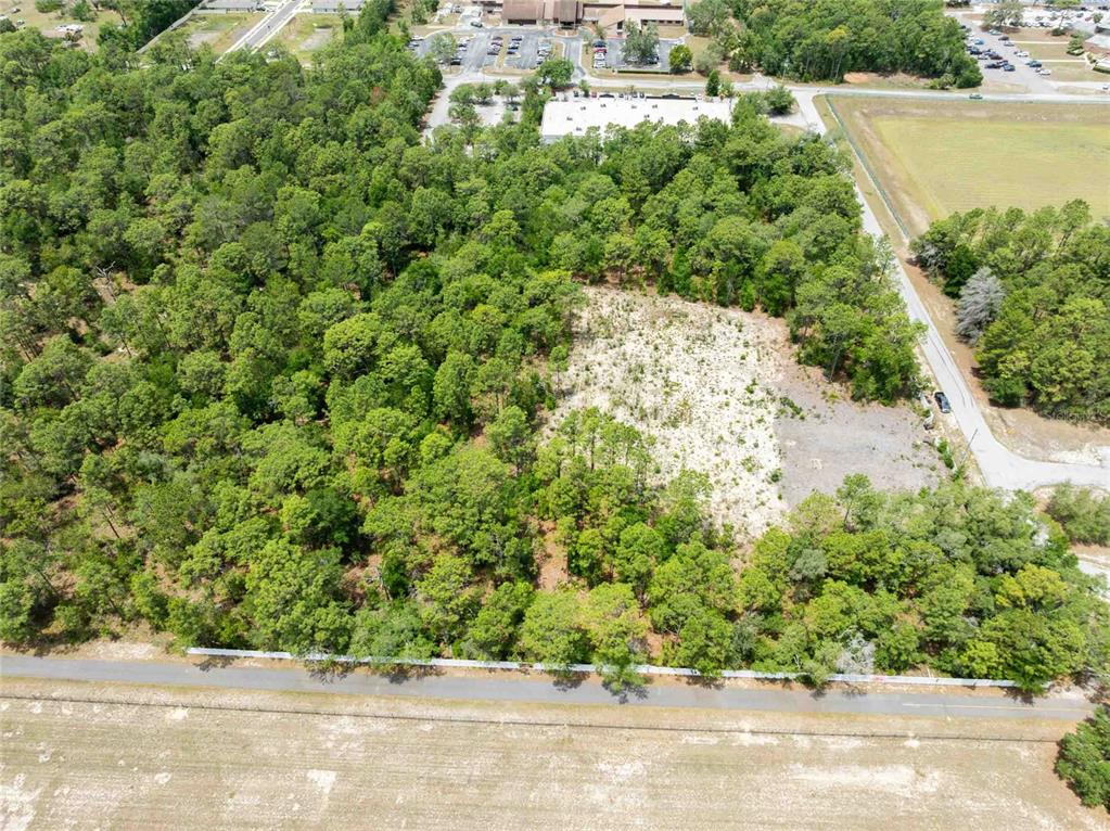15022 Gar Street Spring Hill, FL 34609 - Photo 12 of 26 an aerial view of a houses with a yard and lake view