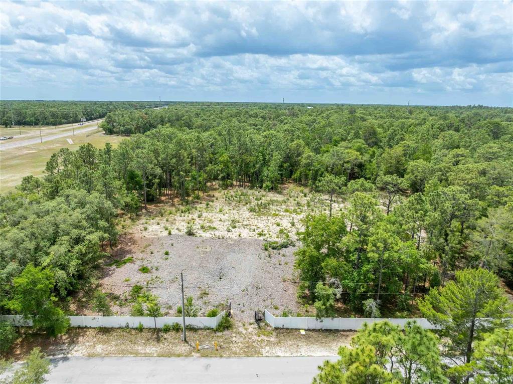 15022 Gar Street Spring Hill, FL 34609 - Photo 4 of 26 a view of a lake with a yard