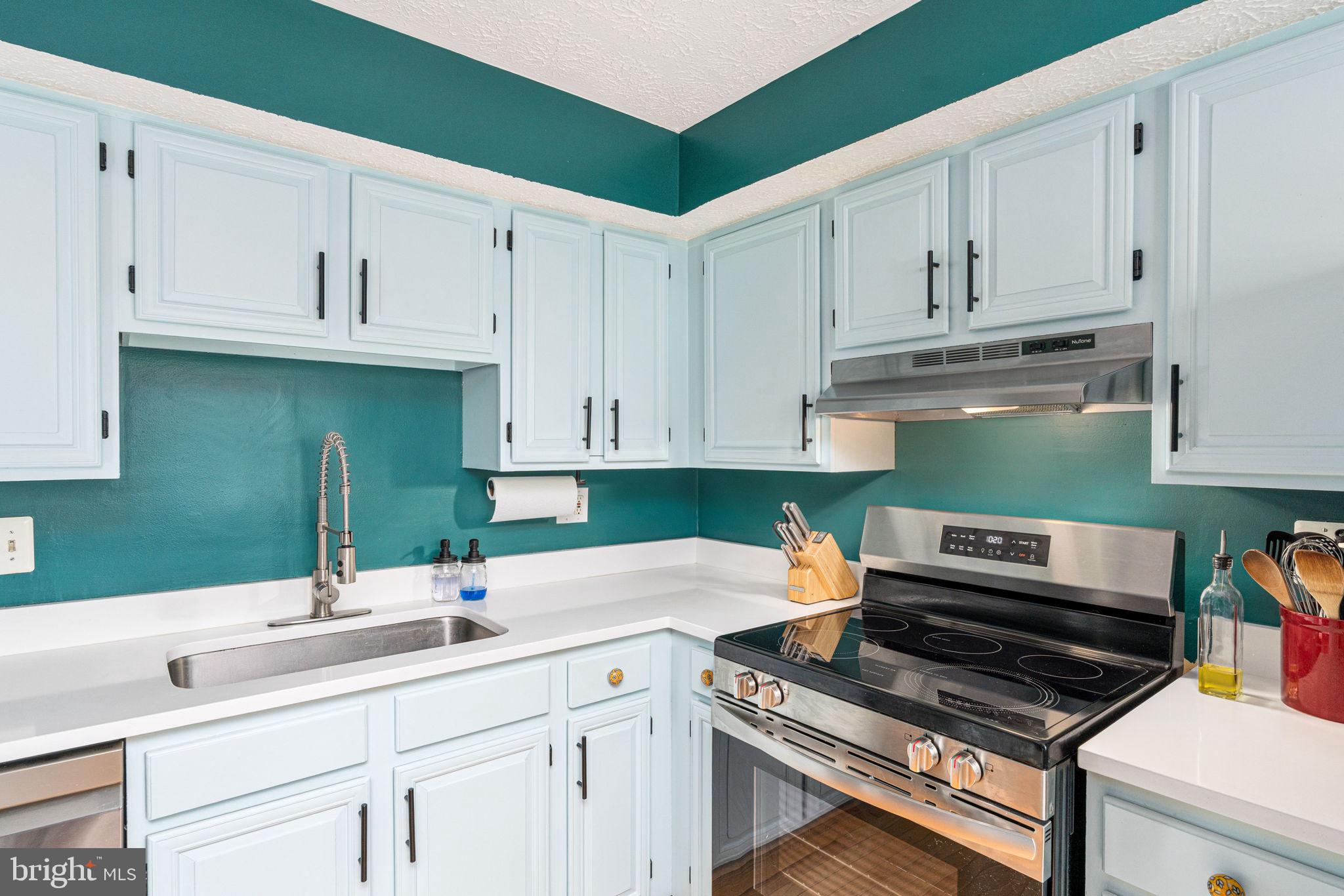 11537 Ivy Bush Court Reston, VA 20191 - Photo 16 of 49 a kitchen with white cabinets and sink