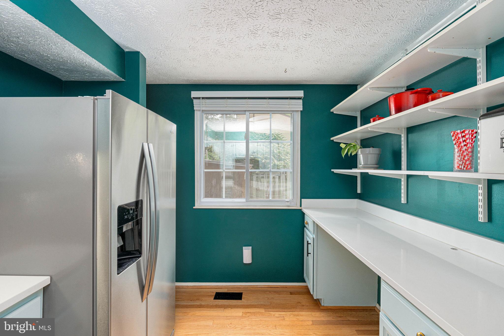 11537 Ivy Bush Court Reston, VA 20191 - Photo 17 of 49 a kitchen with window and refrigerator