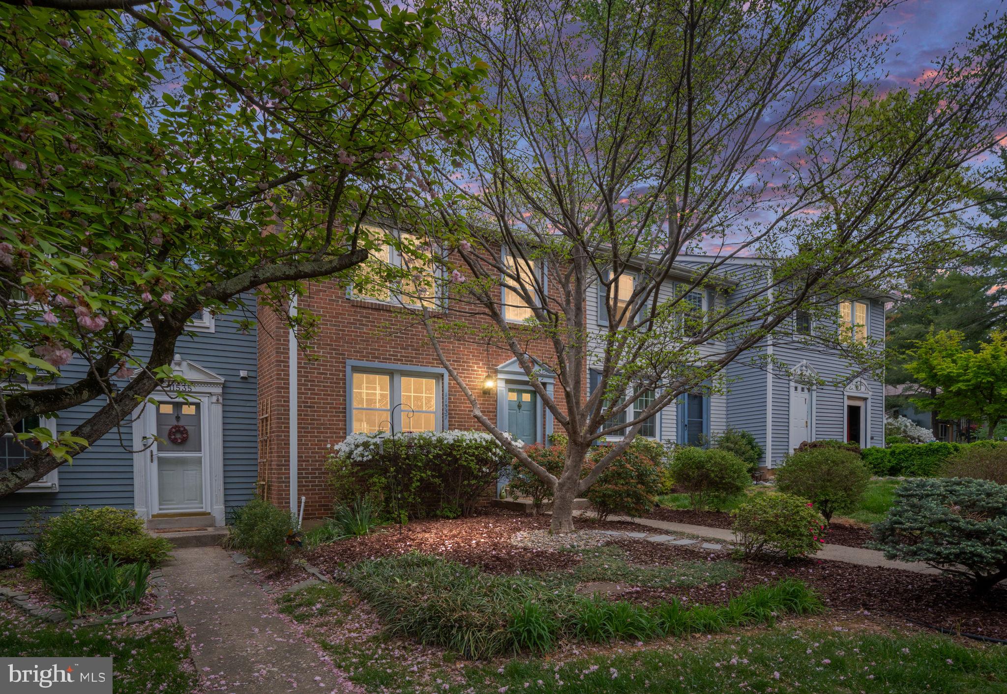 11537 Ivy Bush Court Reston, VA 20191 - Photo 2 of 49 a front view of a house with garden and trees