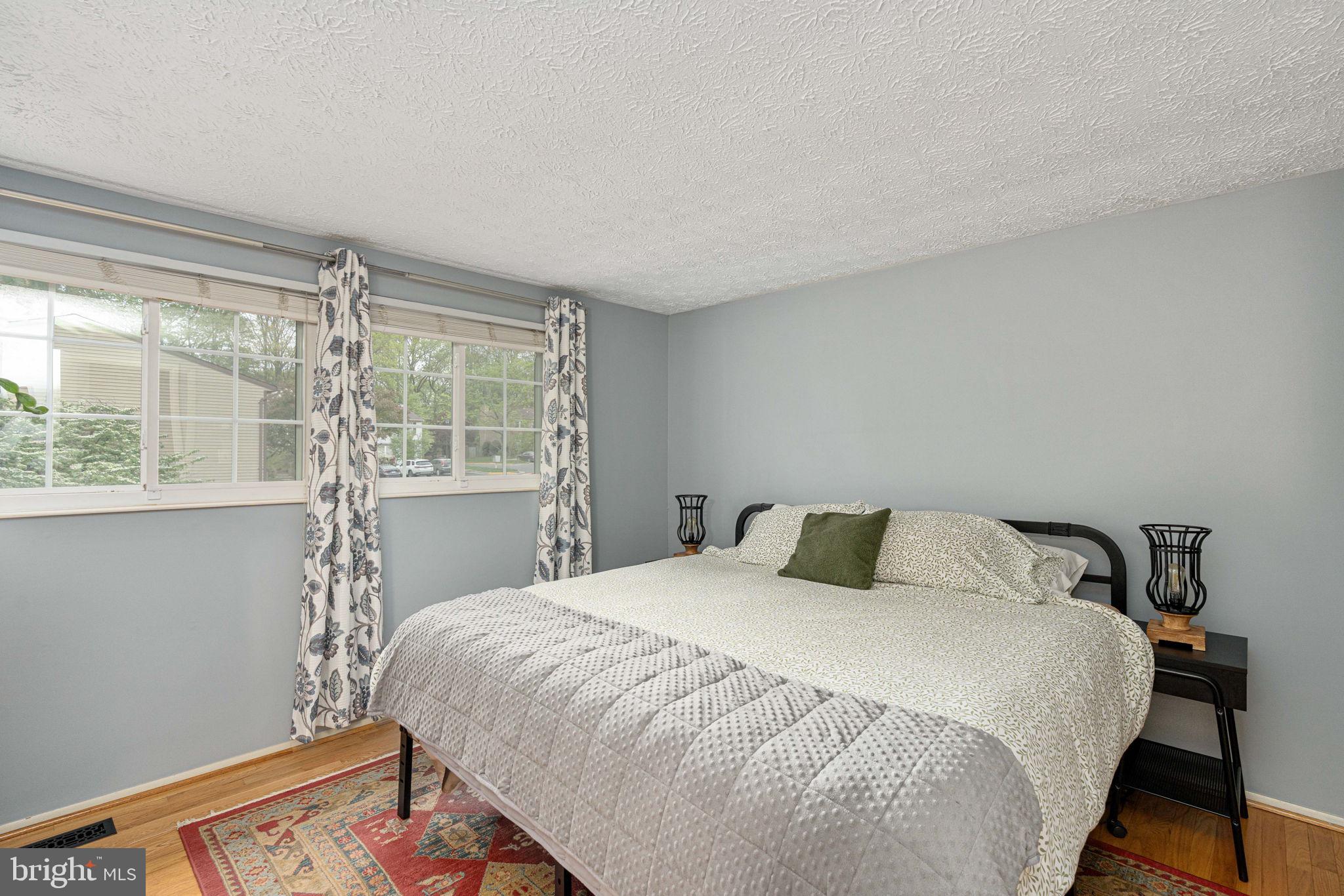 11537 Ivy Bush Court Reston, VA 20191 - Photo 21 of 49 a bedroom with a bed and a window