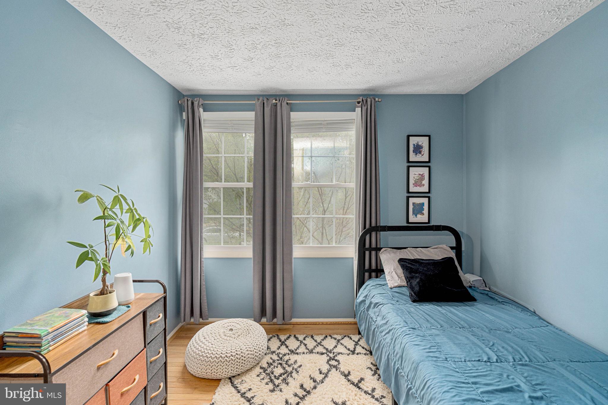 11537 Ivy Bush Court Reston, VA 20191 - Photo 26 of 49 a bedroom with a bed and a window