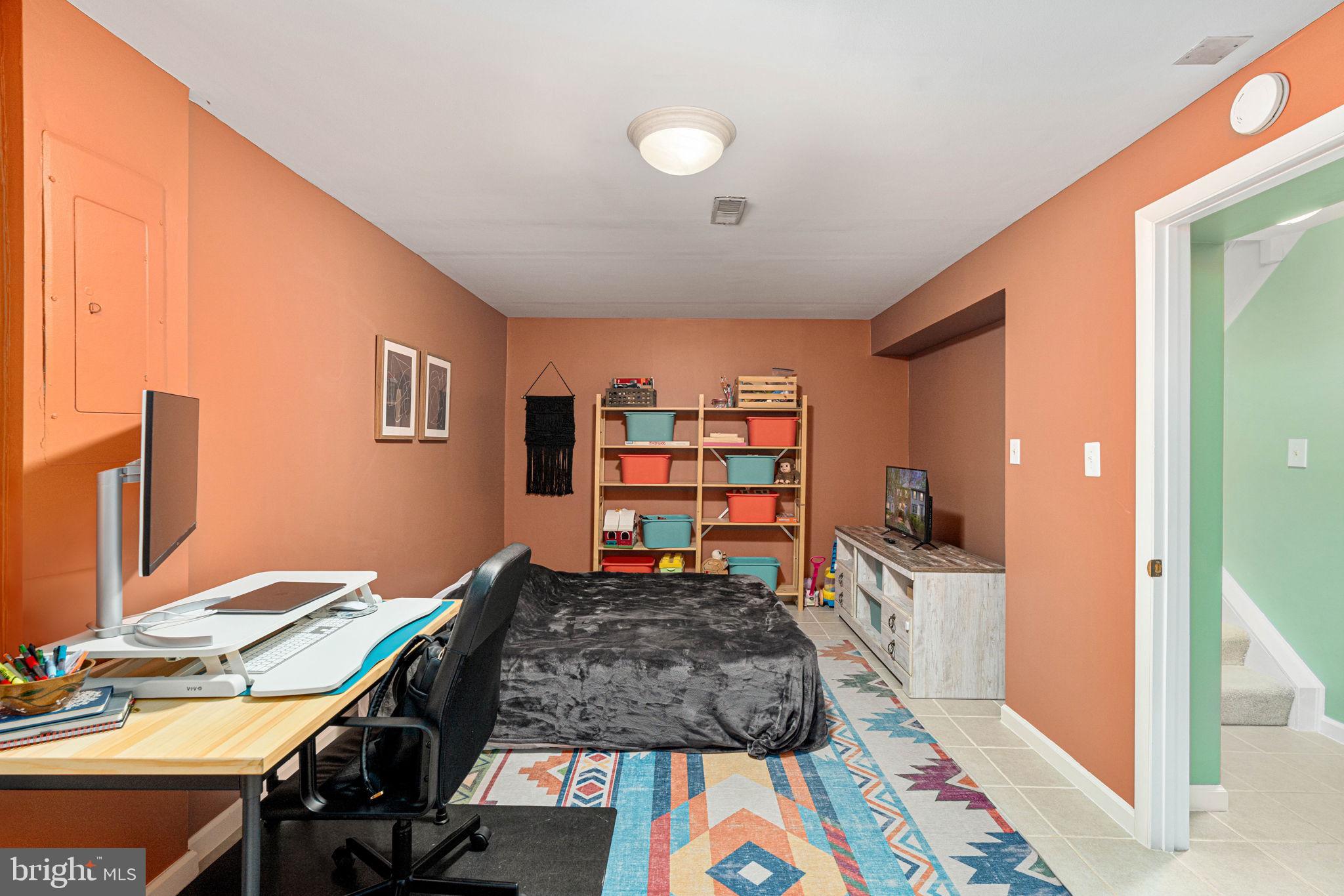 11537 Ivy Bush Court Reston, VA 20191 - Photo 33 of 49 a bed room with a bed and a tv