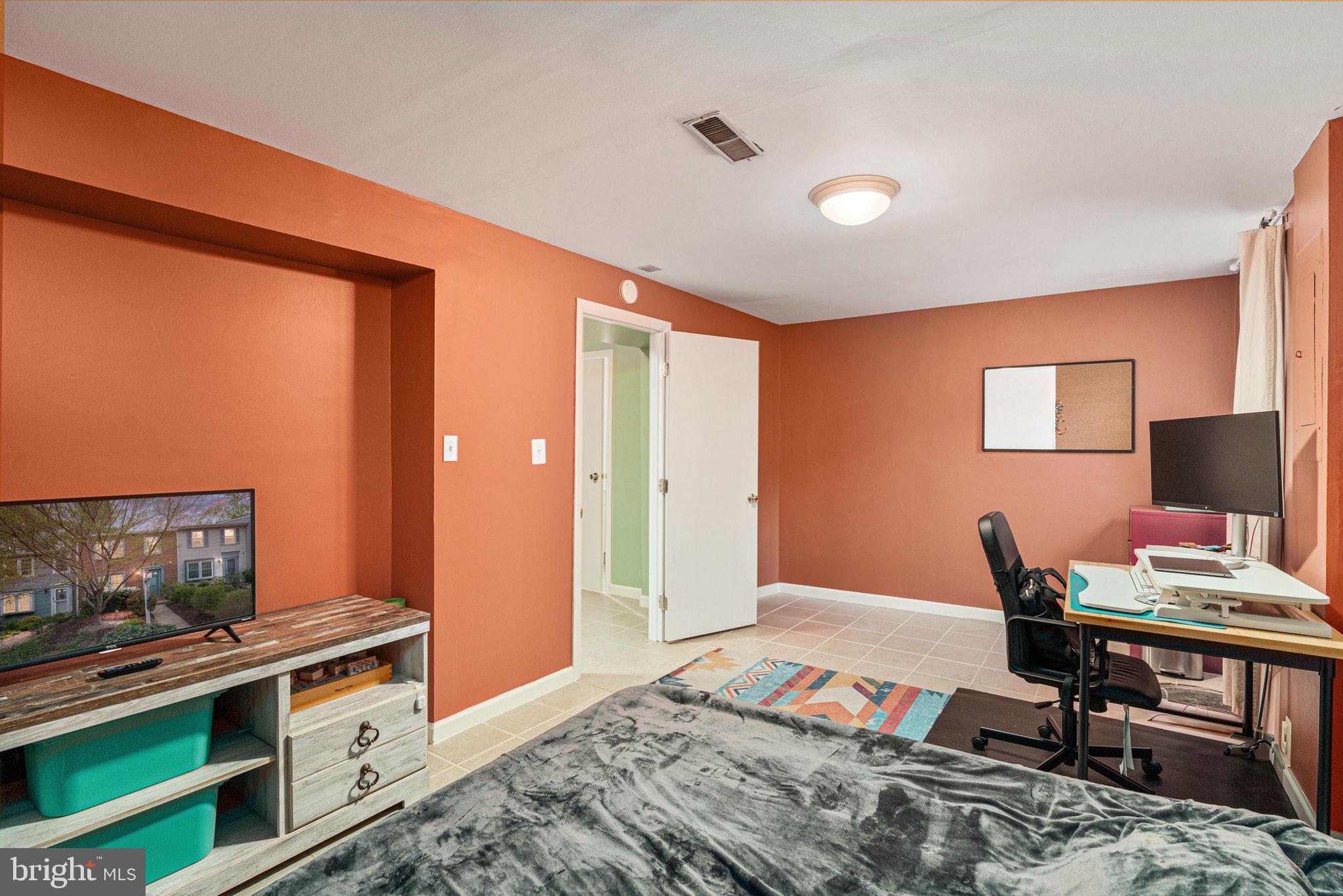 11537 Ivy Bush Court Reston, VA 20191 - Photo 34 of 49 a bedroom with furniture and a wooden floor